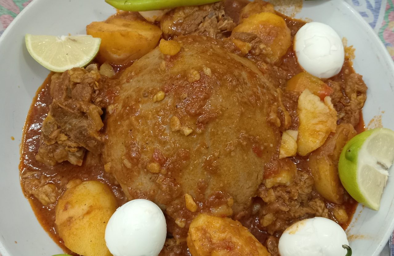 Bazin (Libyan Barley Dough Dome with Lamb Tomato Sauce)